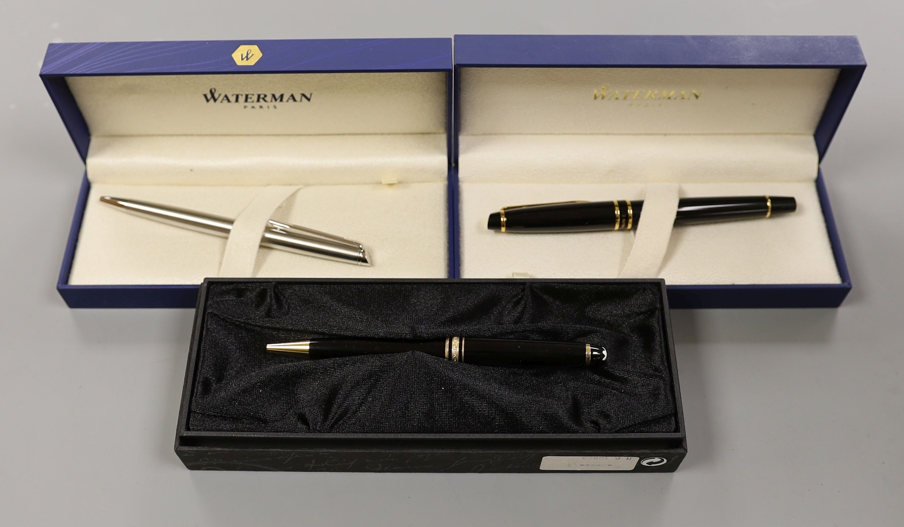 A Waterman fountain pen and ballpoint pen and a Mont Blanc Meisterstuck pen, all cased